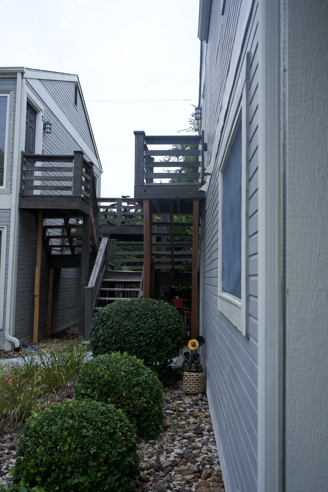Grey composite decking laid out around a skylight on an apartment landing