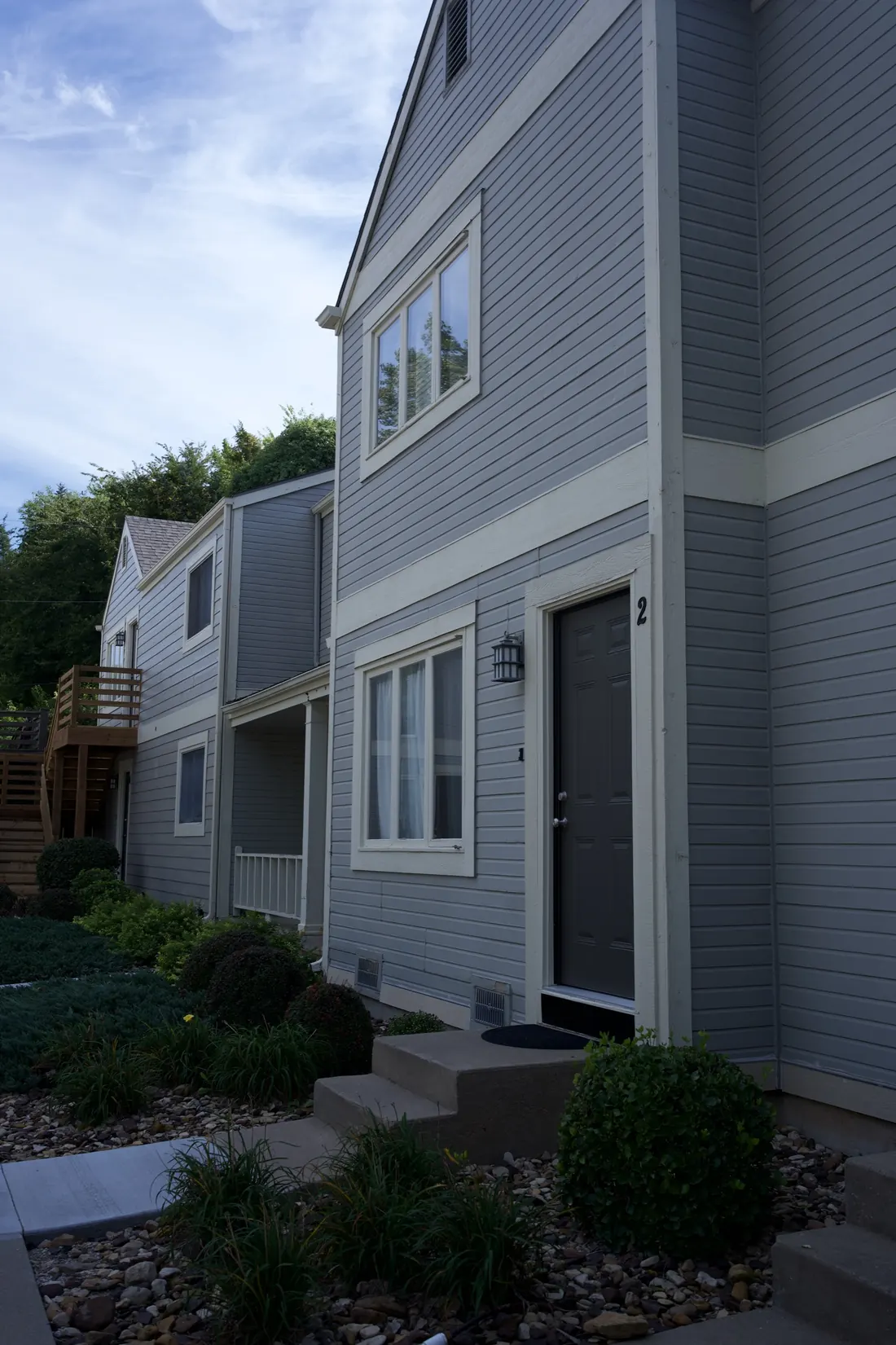 Apartment block elevation showing the siding due for replacement