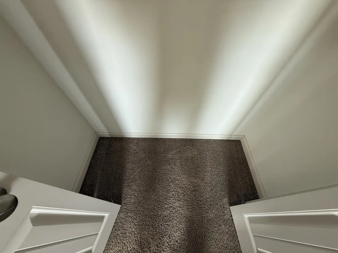 New carpet finished along a run of built in closets