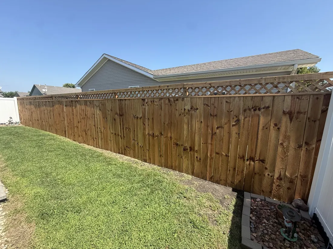 Cedar fence behind a gravel planting bed