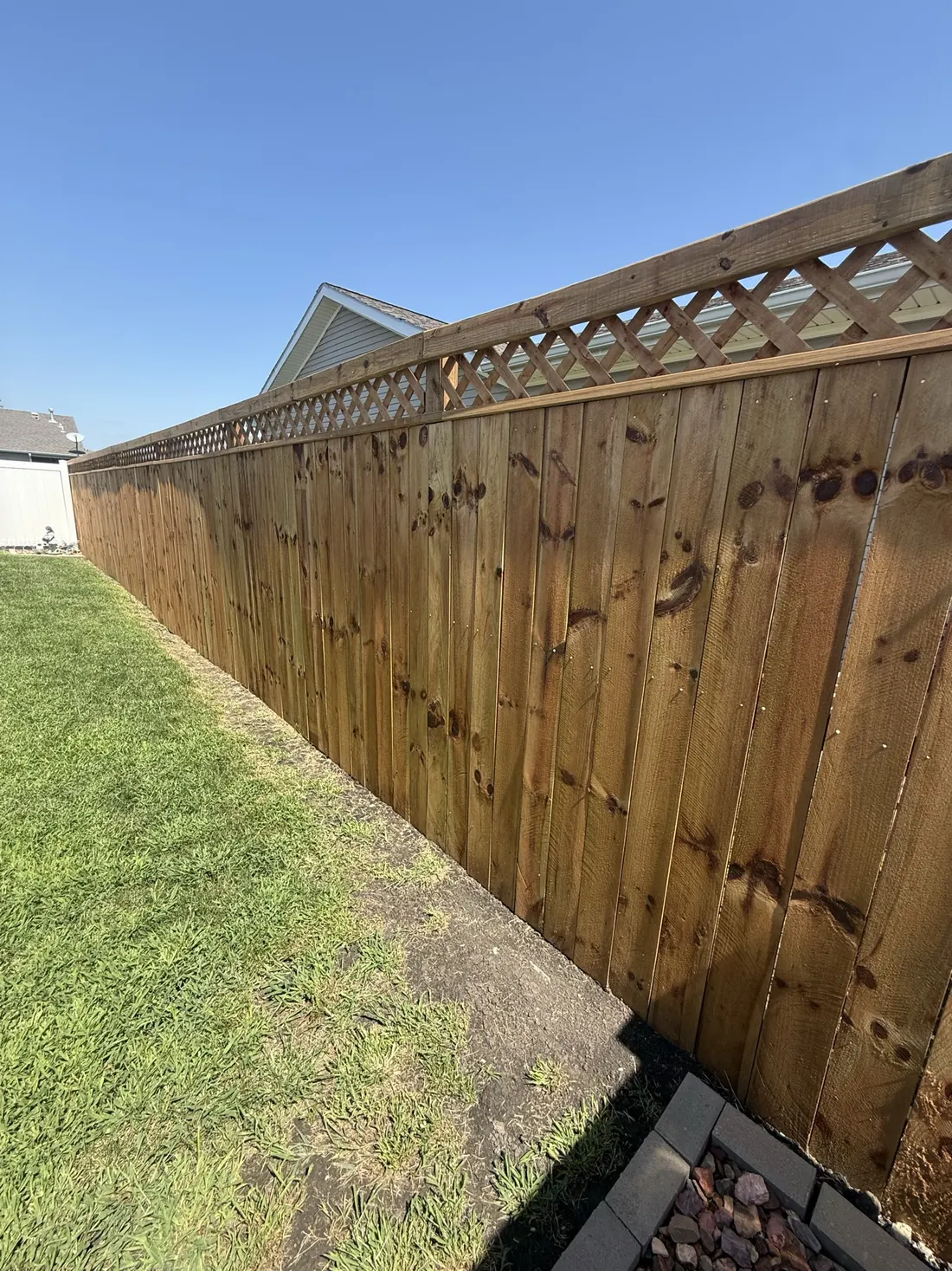 Gate end of a new cedar privacy fence