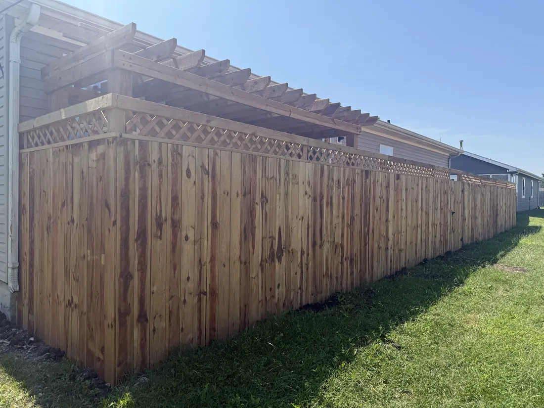New cedar fence seen across a level lawn