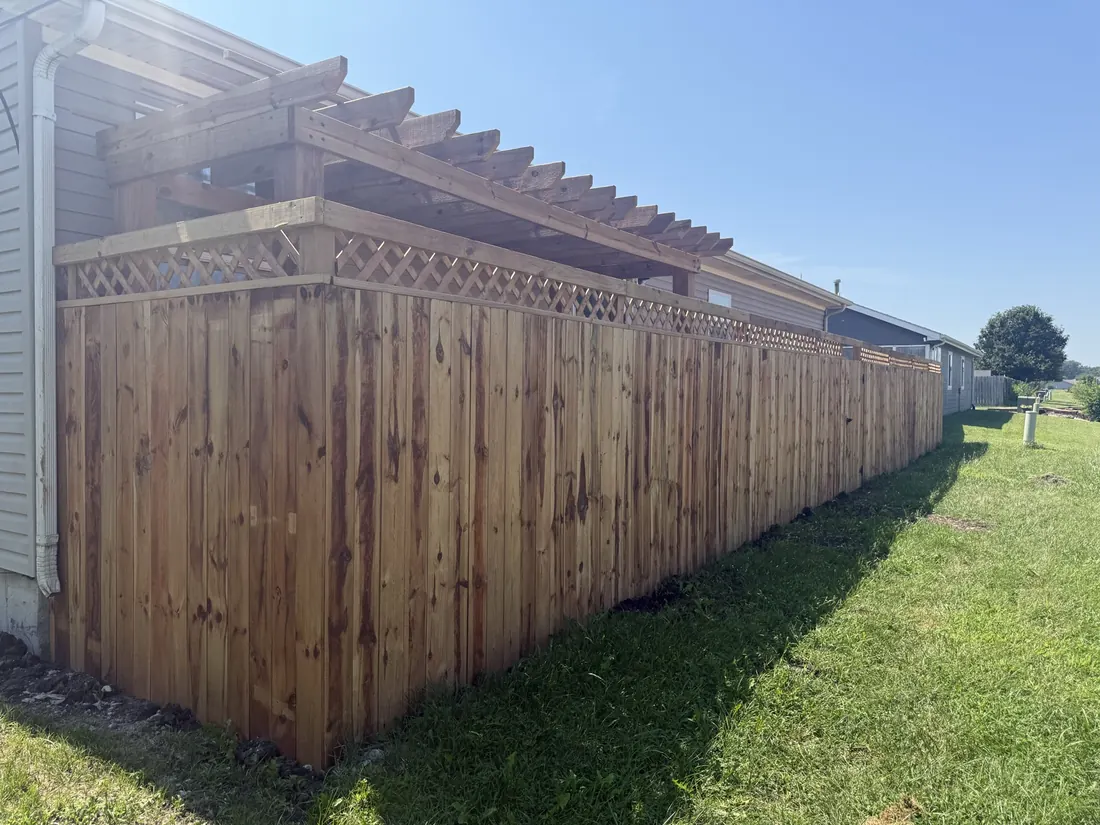 Cedar fence running straight along a property line