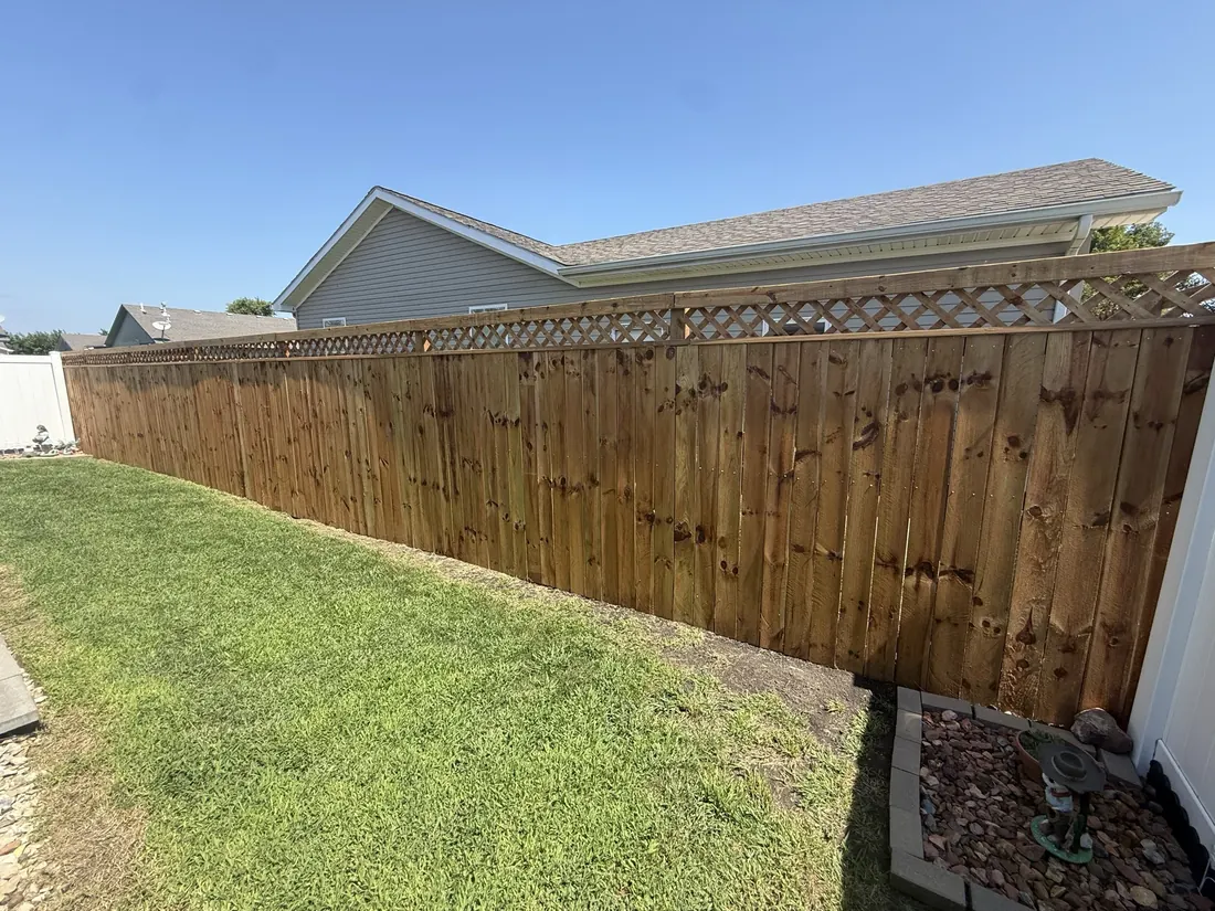 New cedar fence set along the boundary beside a neighbouring roof