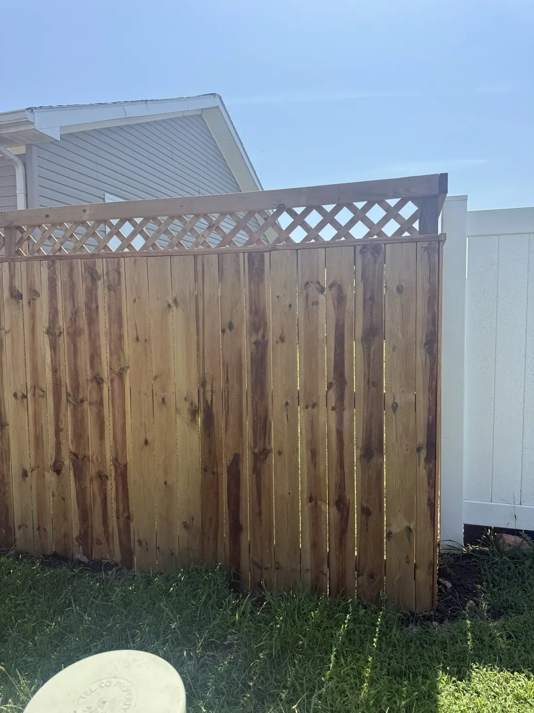 Cedar fence returning to the house wall