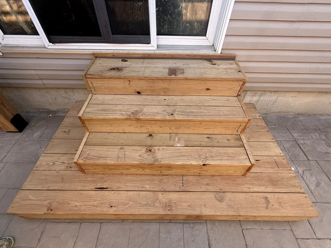 Cedar steps and landing seen from the side of the patio