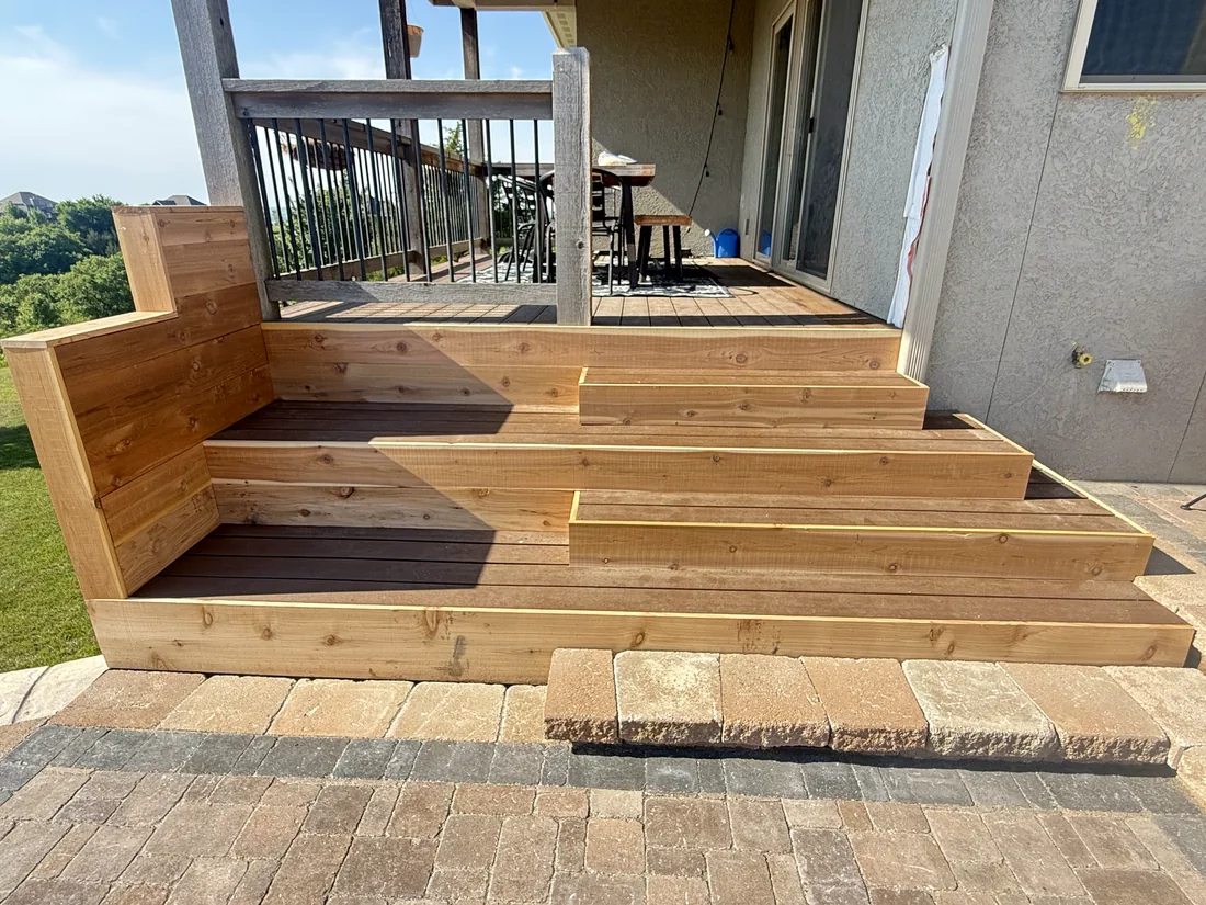 Cedar step treads and corner bench finished against a stucco wall