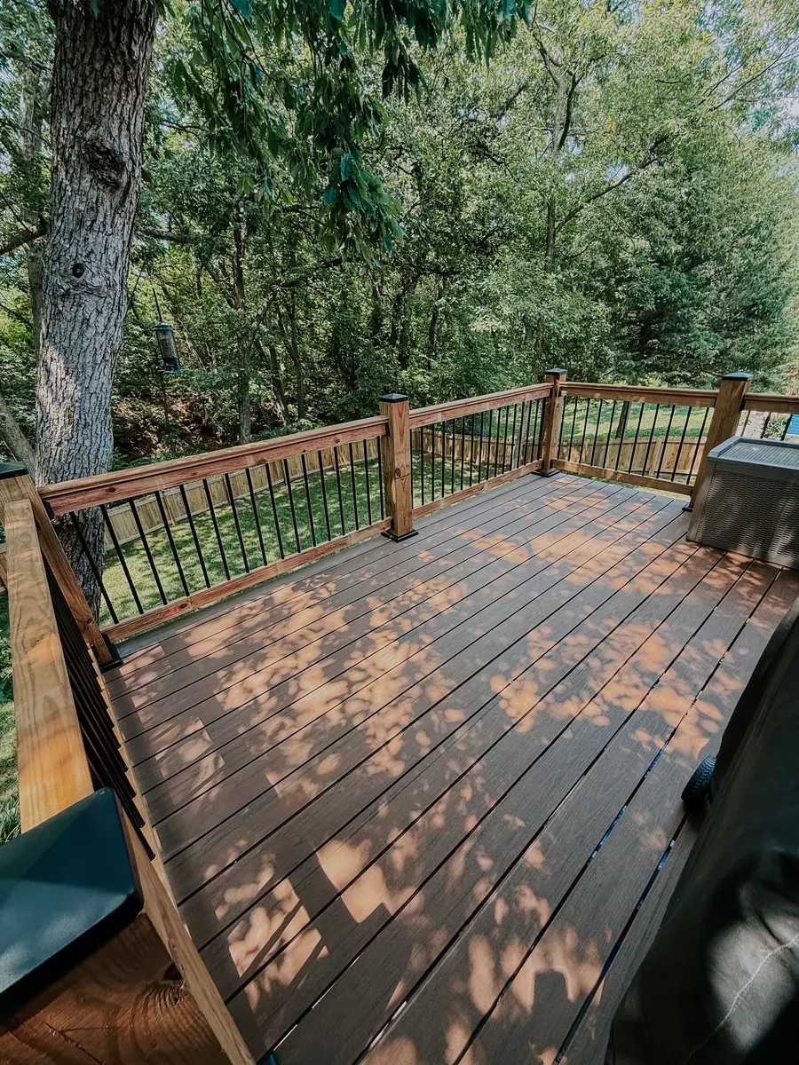 Remodelled deck with new decking boards and black railing