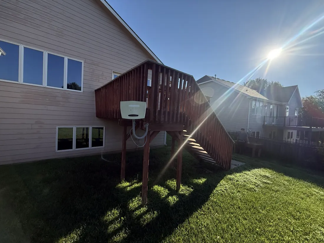 Elevated timber deck on a two storey home before its resurfacing