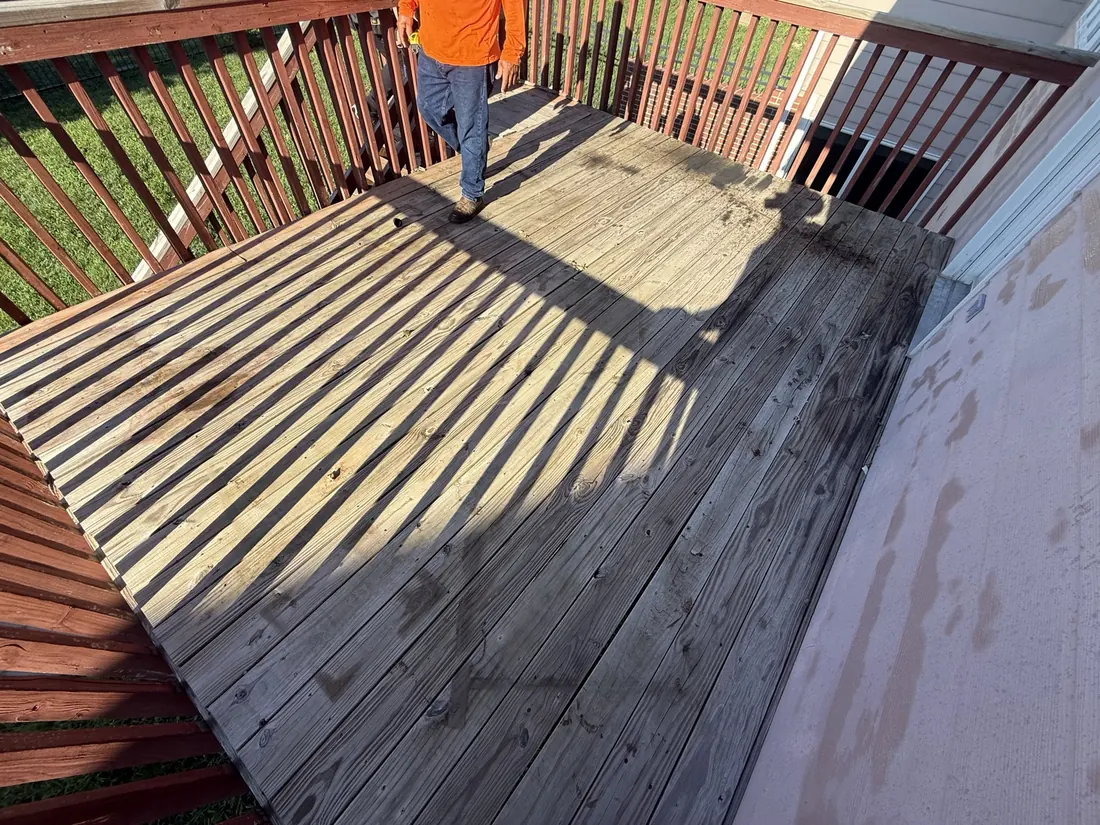 Setting out new deck boards across the existing frame