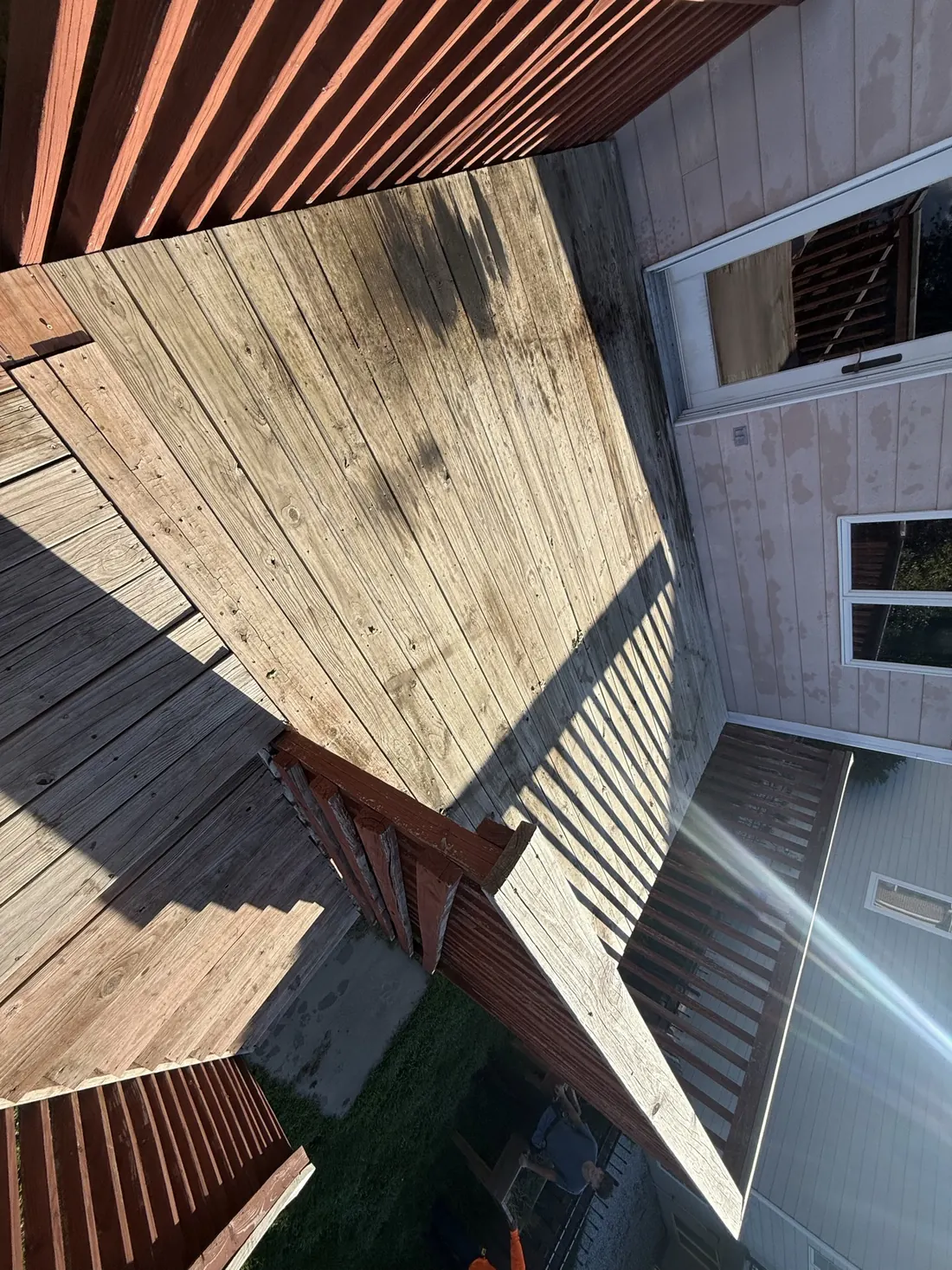 Resurfaced landing outside the back door with new boards throughout