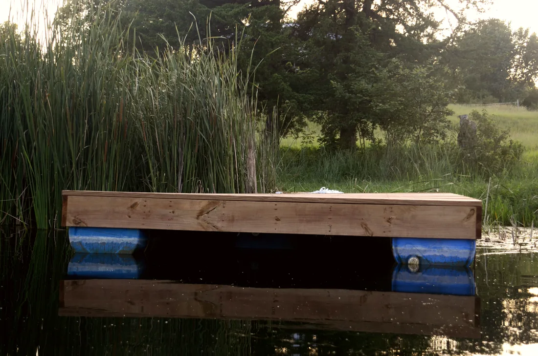 Close view of the barrel floats and cedar frame under a floating dock