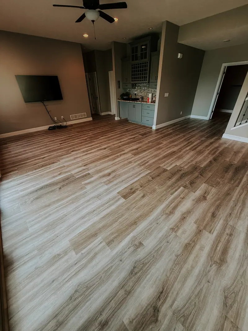 New plank flooring installed across a living room