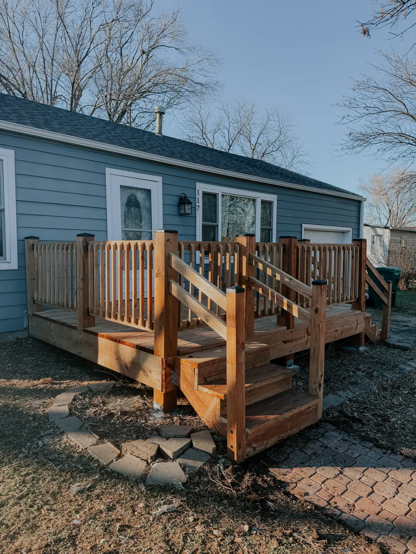 Cedar deck with railings and steps built on a Manhattan, Kansas home