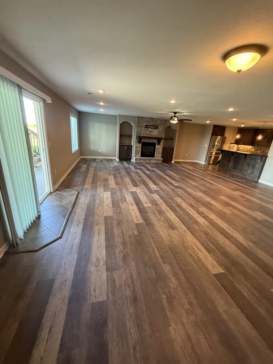 Plank flooring laid through to the kitchen of an open plan home