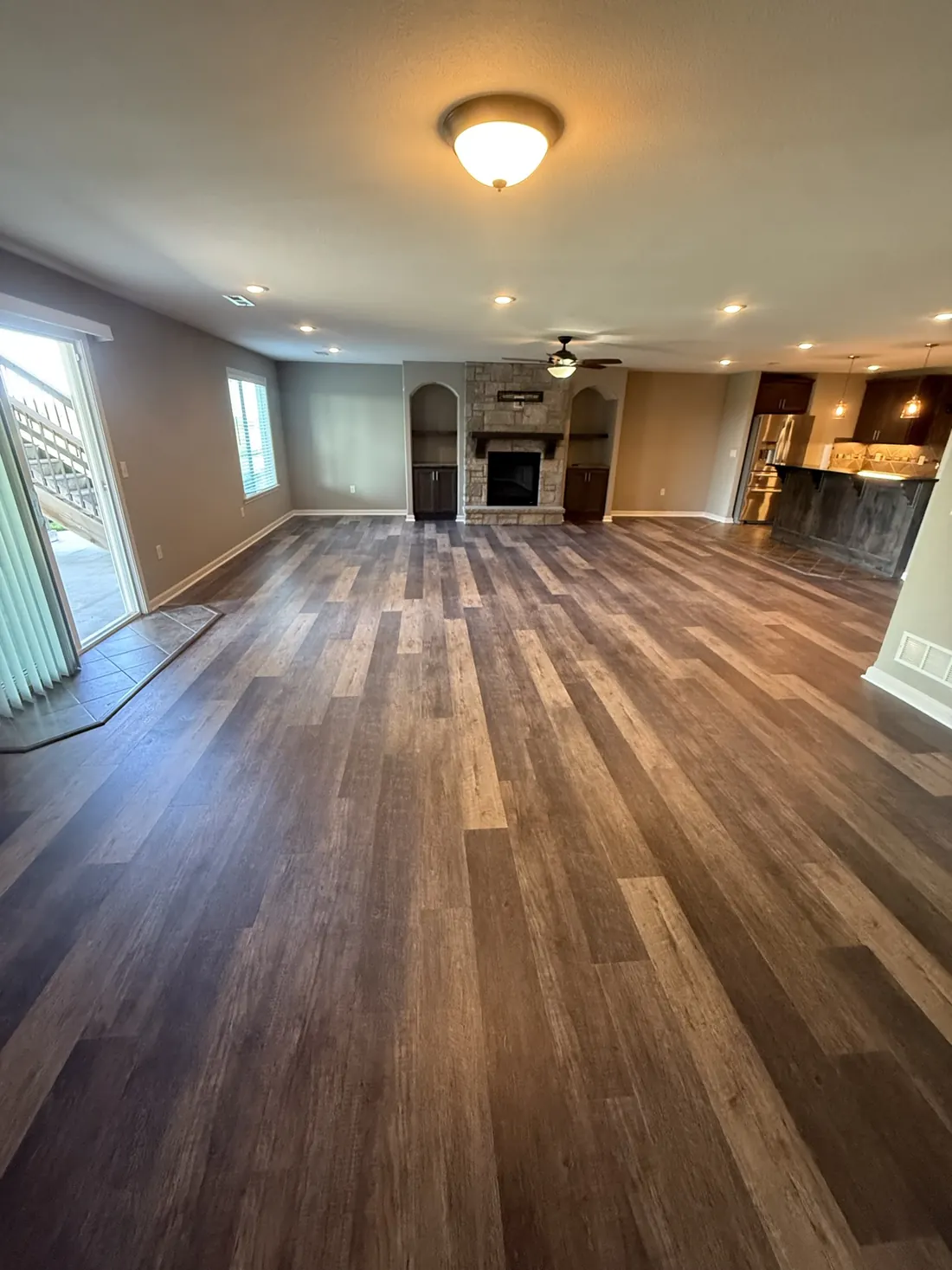 Plank flooring running across a landing at the head of the stairs