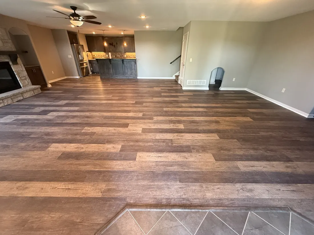Plank flooring carried through an open plan living and dining space