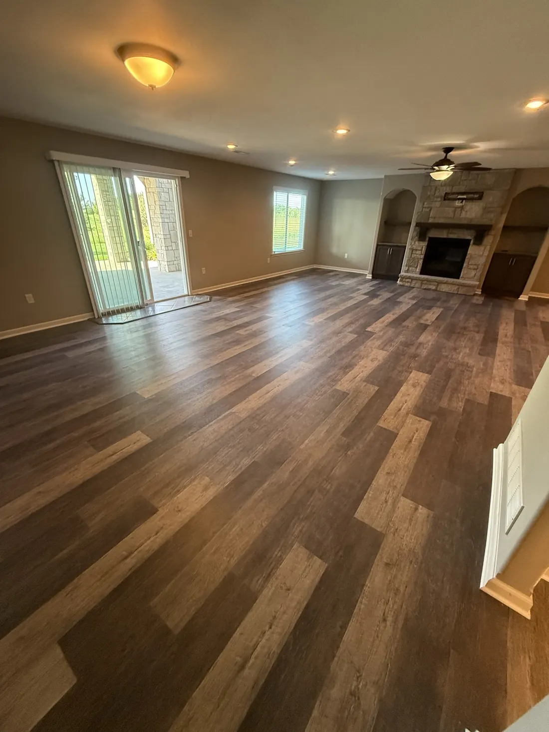 New plank flooring laid across an upper stair landing