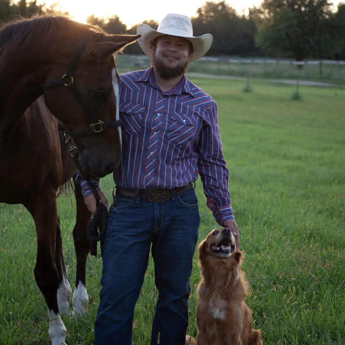 Dimitry Krumbach with his American Quarter Horse Skip and his Golden Retriever Gloria on his Kansas property at sunset